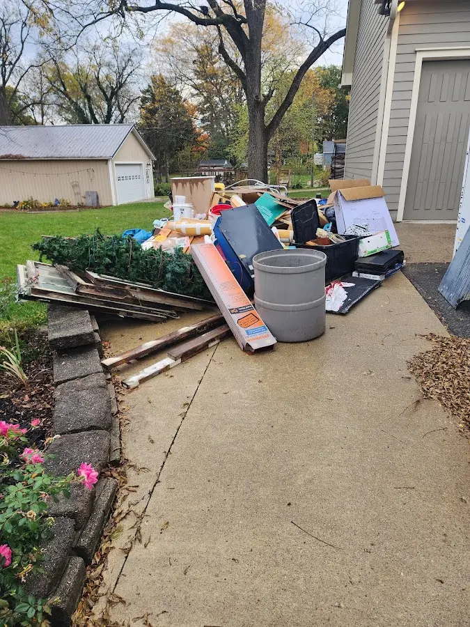 Dumpster being loaded with debris for Commercial Dumpster Rental in Murfreesboro